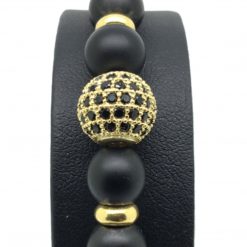 Bracelet perle noire onyx avec perle centrale en zircon et rhodié