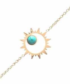 Bracelet souple Acier inoxydable couleur or avec un soleil central avec une petite perle couleur turquoise à l'intérieur.
